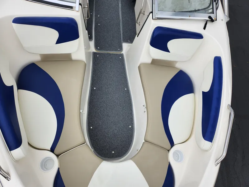 Slide: The Image of 2006 Glastron SX 195 boat interior with blue and beige seating. - 19