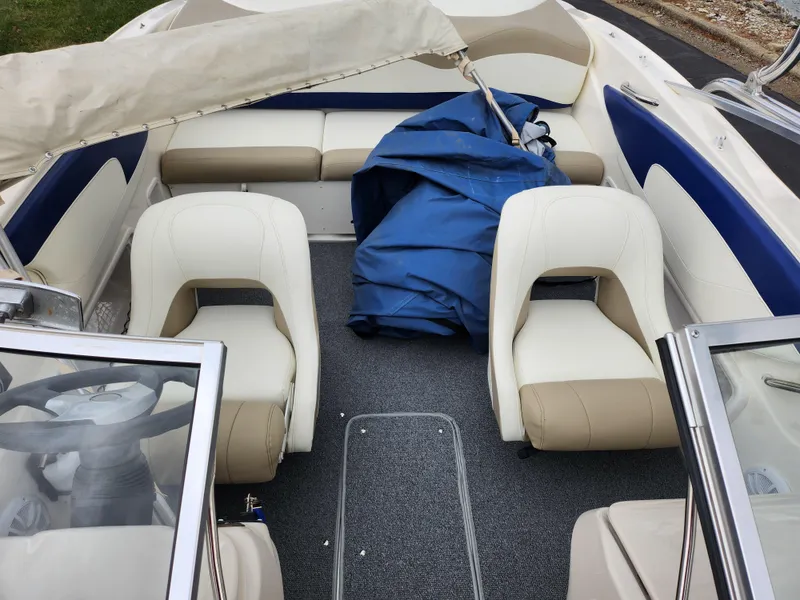 Slide: The Image of 2006 Glastron SX 195 boat interior with beige and blue seating. - 21