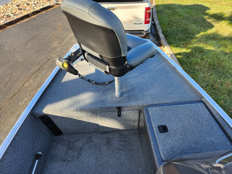 Slide: The Image of 2020 Tracker Bass Tracker Classic XL boat interior with swivel seat and storage compartment. - 14