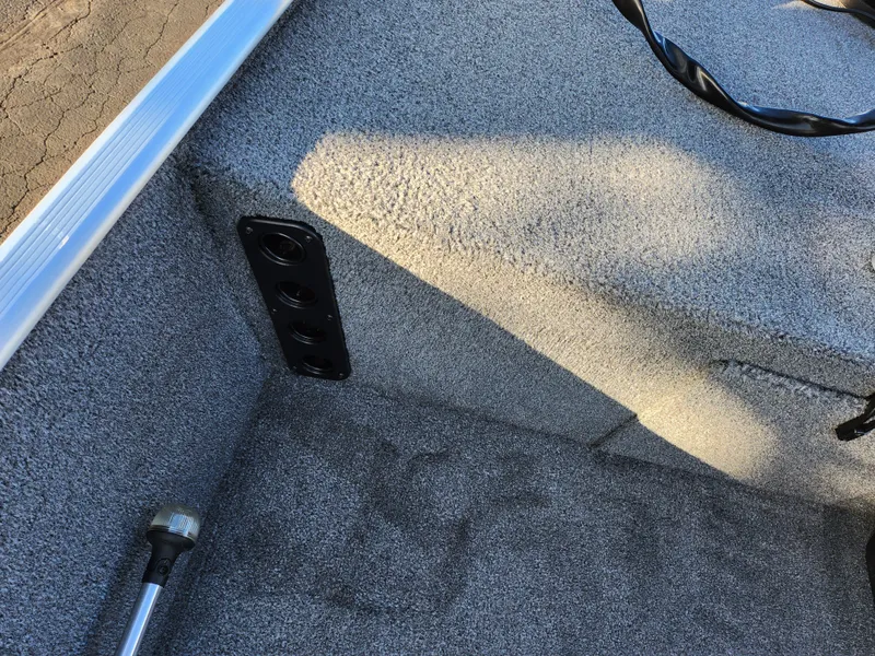 Slide: The Image of 2020 Tracker Bass Tracker Classic XL interior with carpeted flooring and mounted rod holder. - 16