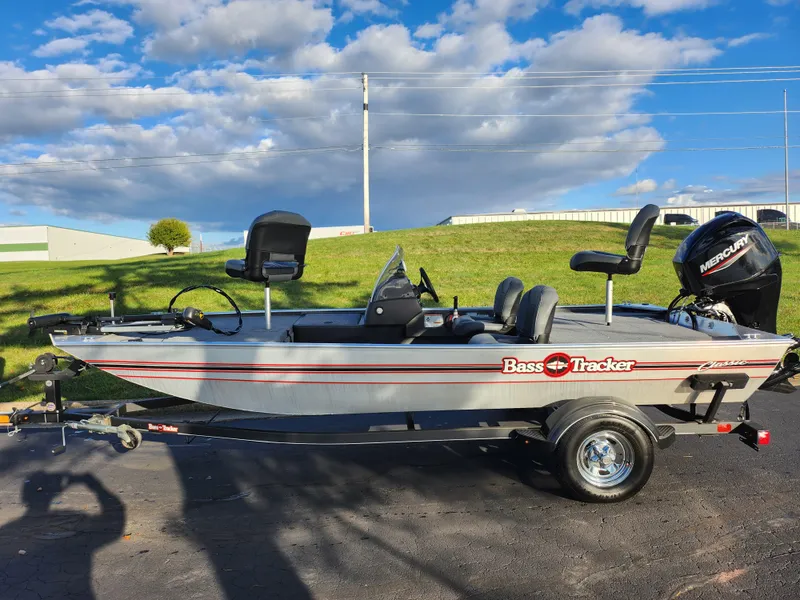 Slide: The Image of 2020 Tracker Bass Tracker Classic XL boat on trailer under blue sky. - 5