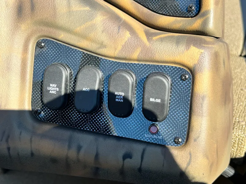 Slide: The Image of Control panel of 2025 G3 Sportsman 1610 Vinyl boat with switches for navigation and bilge. - 12