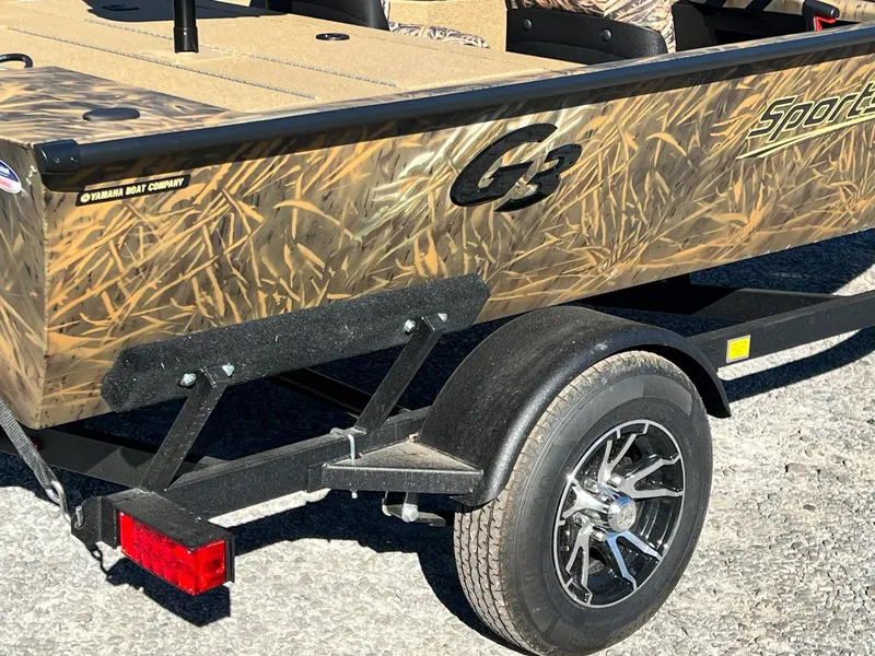 Slide: The Image of 2025 G3 Sportsman 1610 Vinyl boat with camouflage design on a trailer. - 15