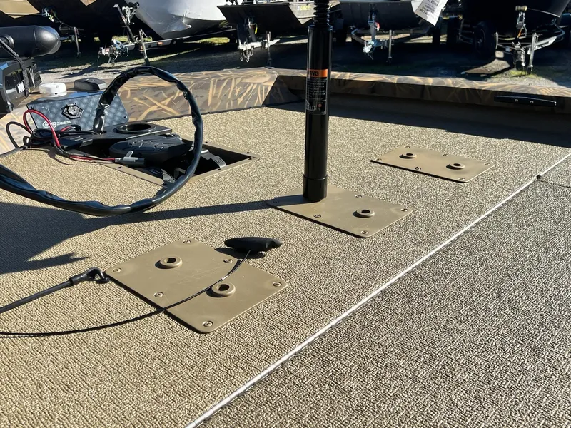 Slide: The Image of 2025 G3 Sportsman 1610 Vinyl boat deck with mounted equipment and wiring. - 18