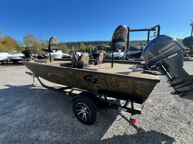Slide: The Image of 2025 G3 Sportsman 1610 Vinyl boat with Yamaha motor on trailer. - 2