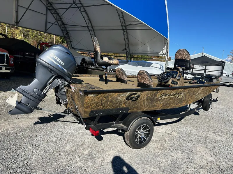 Slide: The Image of 2025 G3 Sportsman 1610 Vinyl boat with Yamaha motor, parked outdoors. - 20