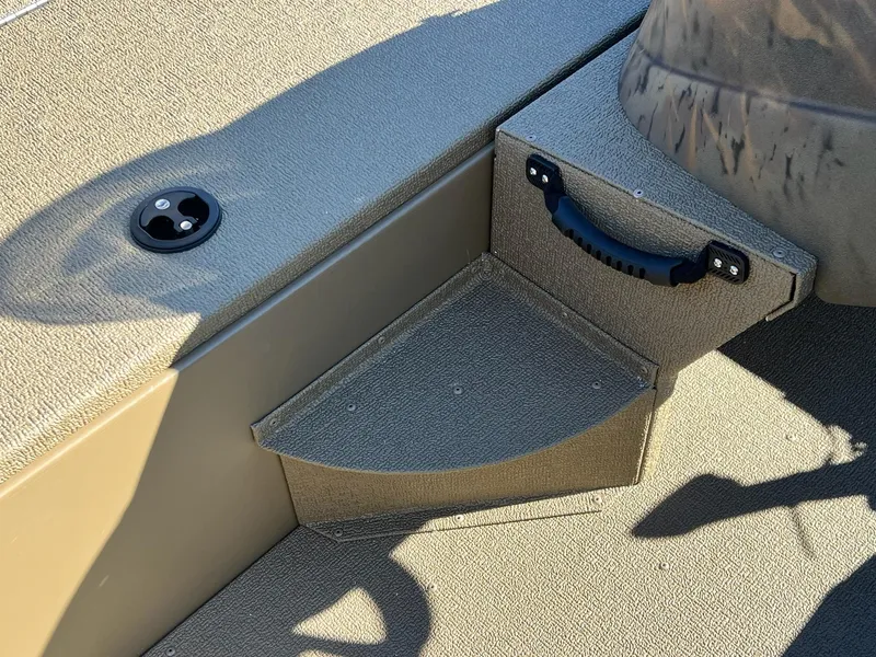 Slide: The Image of 2025 G3 Sportsman 1610 Vinyl boat interior with textured flooring and handle. - 27