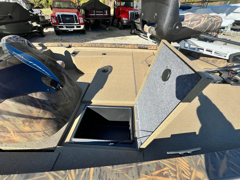 Slide: The Image of 2025 G3 Sportsman 1610 Vinyl boat interior with open storage compartment. - 3