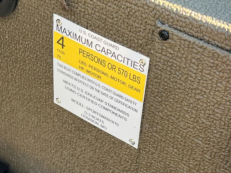 Slide: The Image of Capacity label on 2025 G3 Sportsman 1610 Vinyl boat, max 4 persons or 570 lbs. - 30