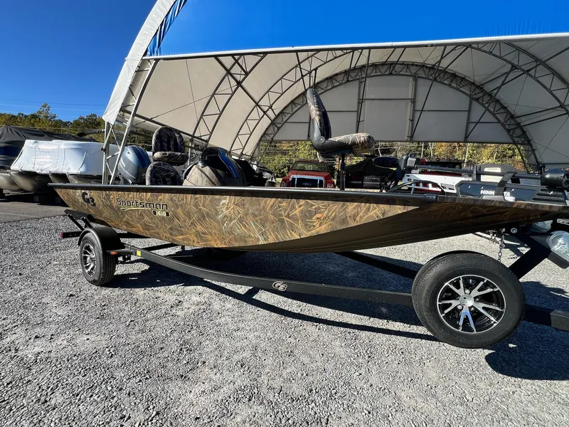 Slide: The Image of 2025 G3 Sportsman 1610 Vinyl boat on trailer under canopy. - 31