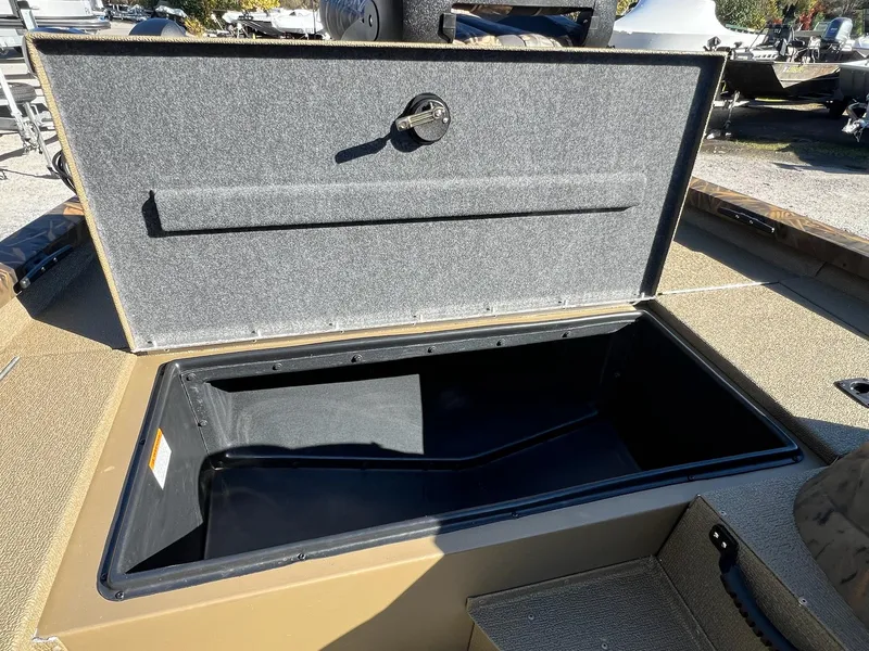 Slide: The Image of Open storage compartment on 2025 G3 Sportsman 1610 Vinyl boat. - 9