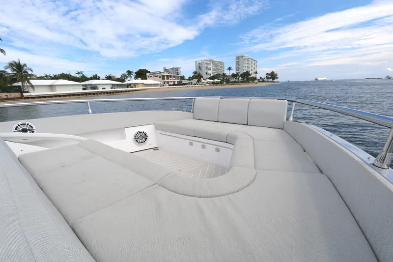 Slide: The Image of Luxurious seating area on 2023 Azimut 47 VERVE yacht, with ocean and cityscape views. - 15
