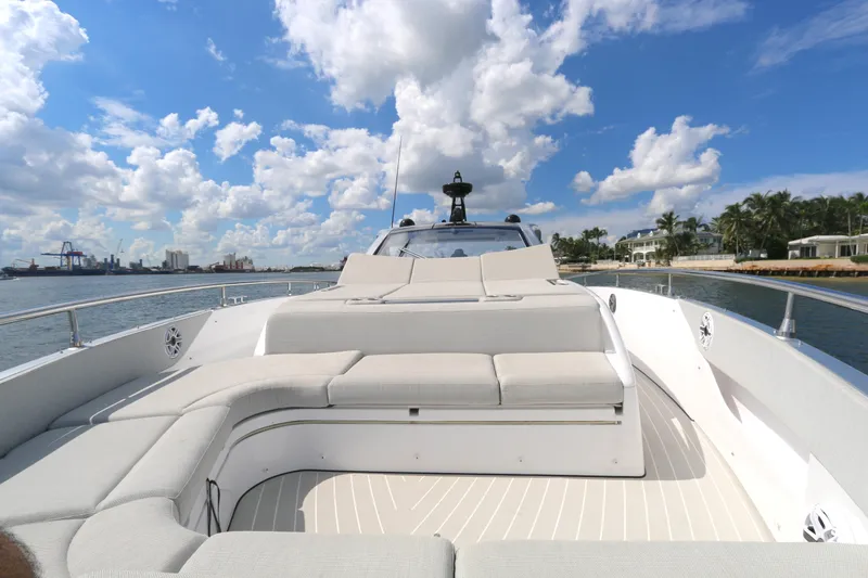 Slide: The Image of 2023 Azimut 47 VERVE yacht with spacious deck, luxurious seating, and scenic waterfront view. - 17