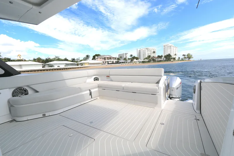 Slide: The Image of 2023 Azimut 47 VERVE yacht deck with luxurious seating, ocean view, and modern design. - 18