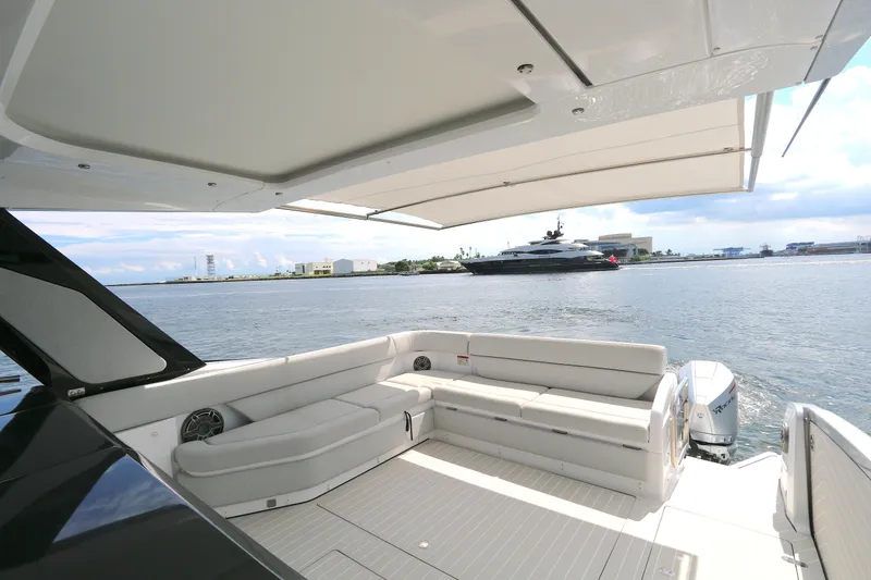 Slide: The Image of Luxurious 2023 Azimut 47 VERVE yacht deck with spacious seating and scenic waterfront view. - 21