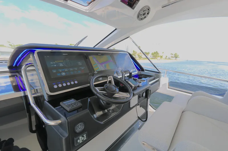 Slide: The Image of 2023 Azimut 47 VERVE yacht cockpit with modern navigation system and luxurious seating. - 3
