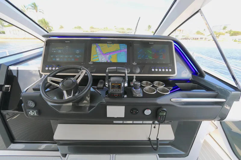 Slide: The Image of Helm of 2023 Azimut 47 VERVE yacht with advanced navigation displays and controls. - 5