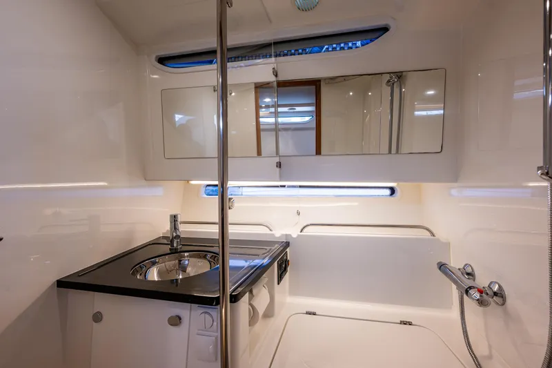 Slide: The Image of Luxurious bathroom in 2021 Nimbus C11 yacht with modern fixtures and sleek design. - 15
