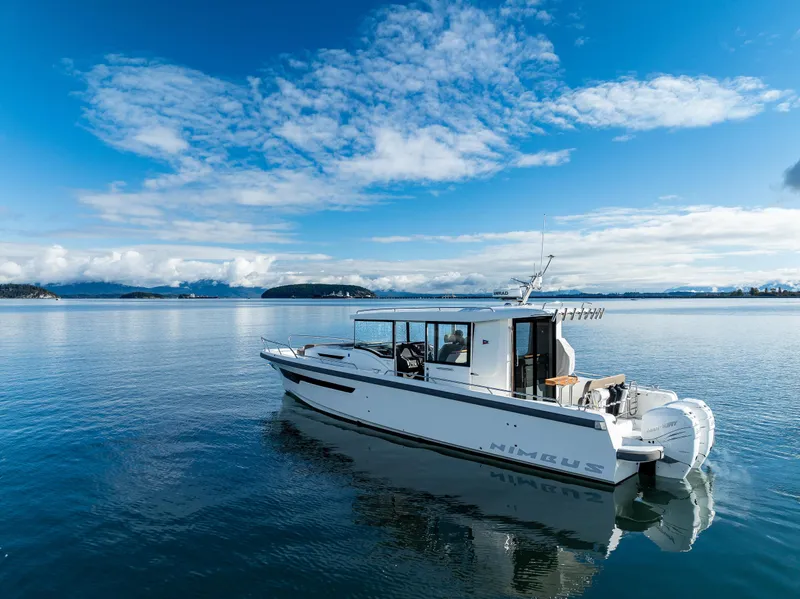 Slide: The Image of Nimbus C11 2021 boat on calm water under a clear blue sky. - 18