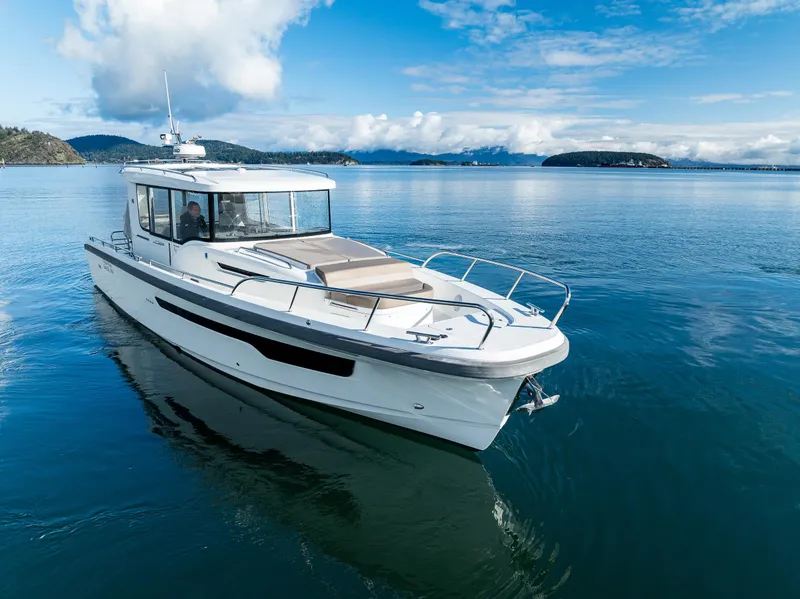 Slide: The Image of Nimbus C11 2021 boat cruising on calm blue waters under a clear sky. - 26