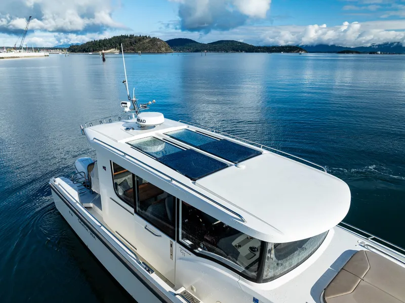 Slide: The Image of Nimbus C11 2021 boat cruising on serene blue waters under a clear sky. - 27