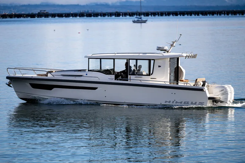 Slide: The Image of Nimbus C11 2021 boat cruising on calm water. - 36