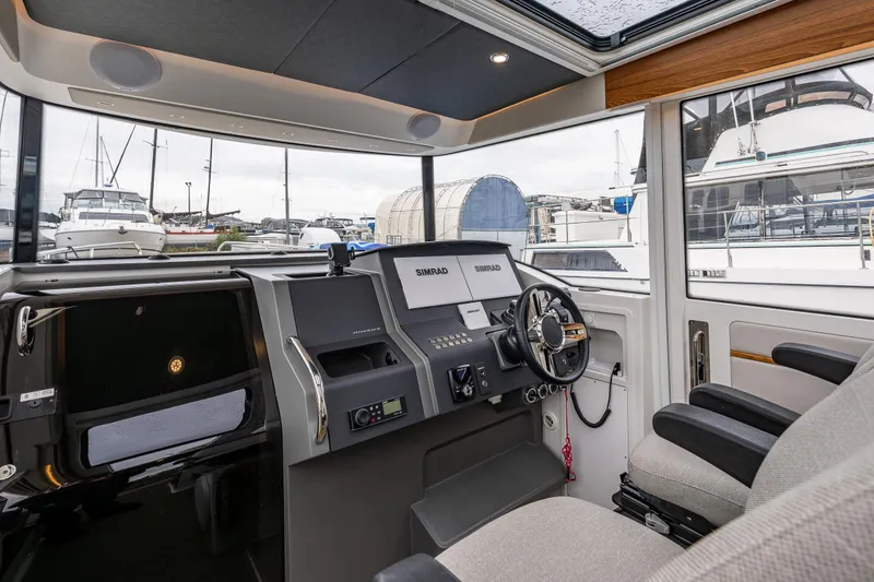 Slide: The Image of Interior of 2021 Nimbus C11 boat cockpit with modern navigation equipment. - 5