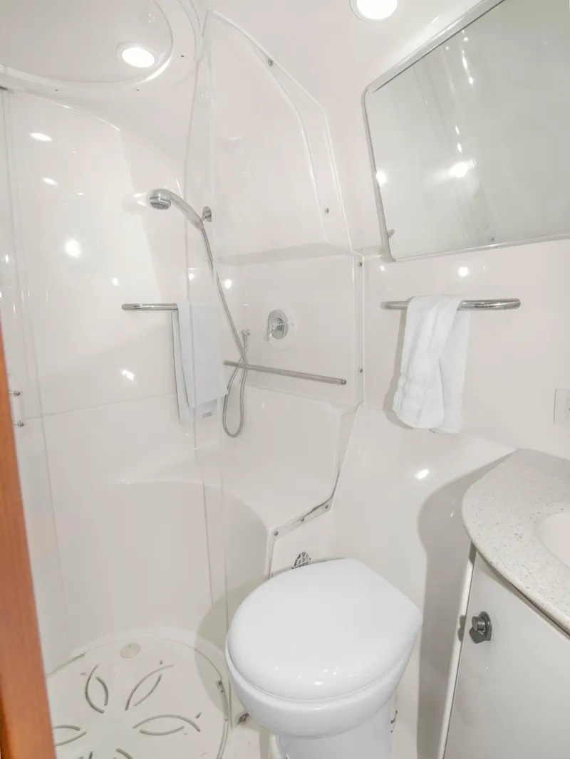 Slide: The Image of 2008 Tiara Yachts 3900 Convertible bathroom with shower, toilet, and sink. - 33