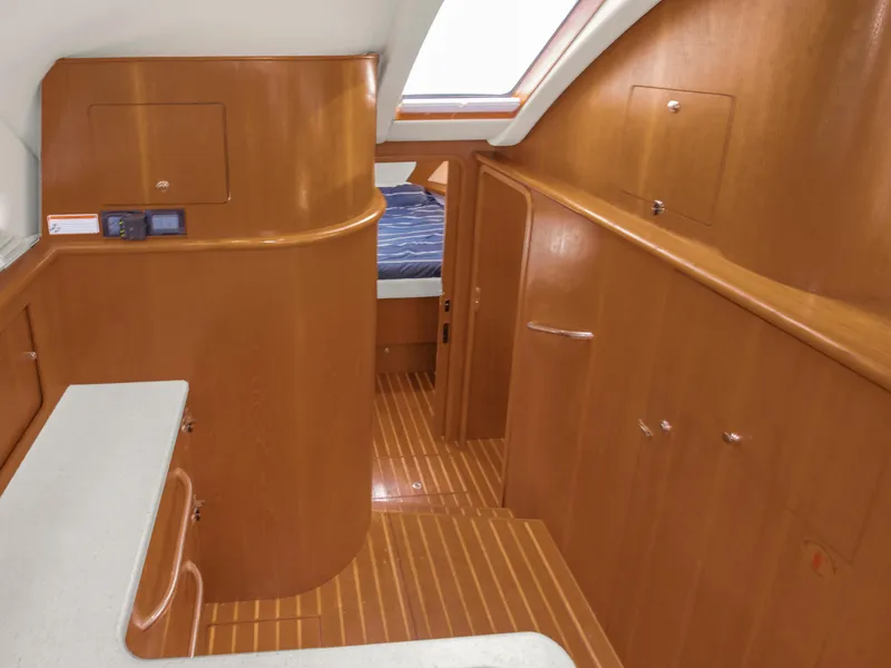 Slide: The Image of Interior of 2008 Tiara Yachts 3900 Convertible with wood finish and cozy cabin. - 42