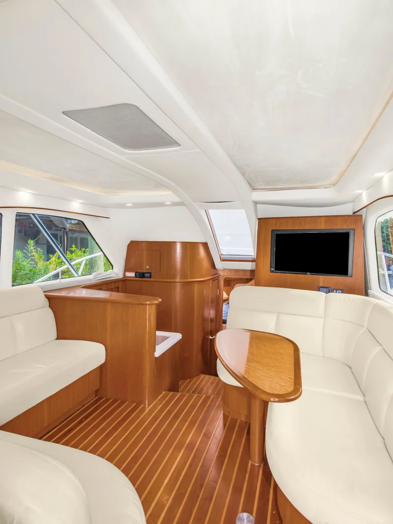 Slide: The Image of Interior of 2008 Tiara Yachts 3900 Convertible with elegant wood and leather seating. - 44