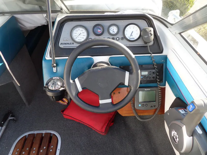 Slide: The Image of 1992 Rinker Captiva 170 OB boat dashboard with steering wheel and gauges. - 10