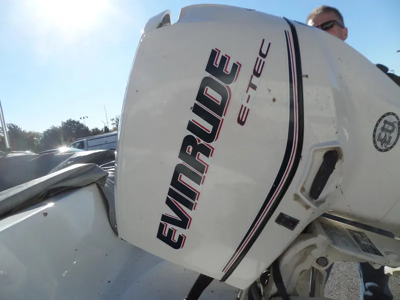 Slide: The Image of Evinrude E-TEC outboard motor on 1992 Rinker Captiva 170 OB boat. - 14