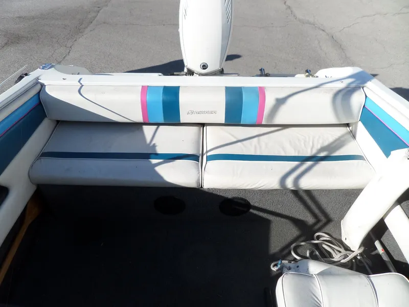 Slide: The Image of 1992 Rinker Captiva 170 OB boat interior with white and blue seating. - 7