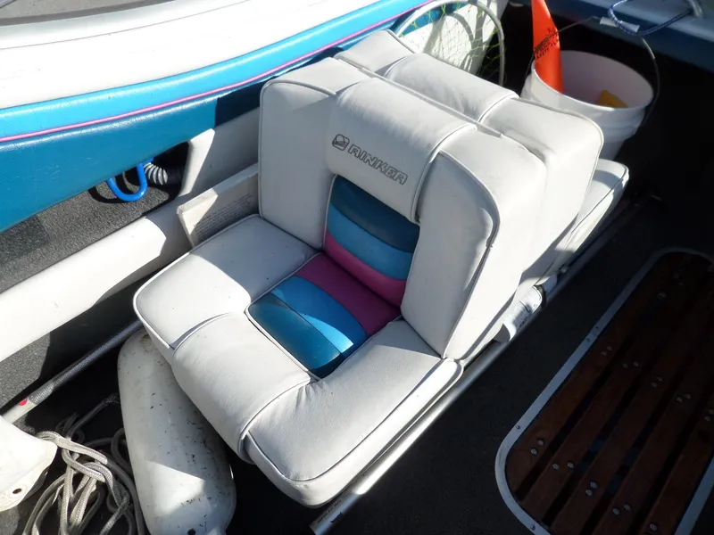 Slide: The Image of 1992 Rinker Captiva 170 OB boat seat with colorful cushions and nautical accessories. - 9