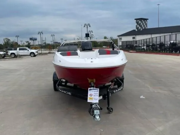 Slide: The Image of 2025 Tahoe T16 boat on trailer in parking lot. - 2
