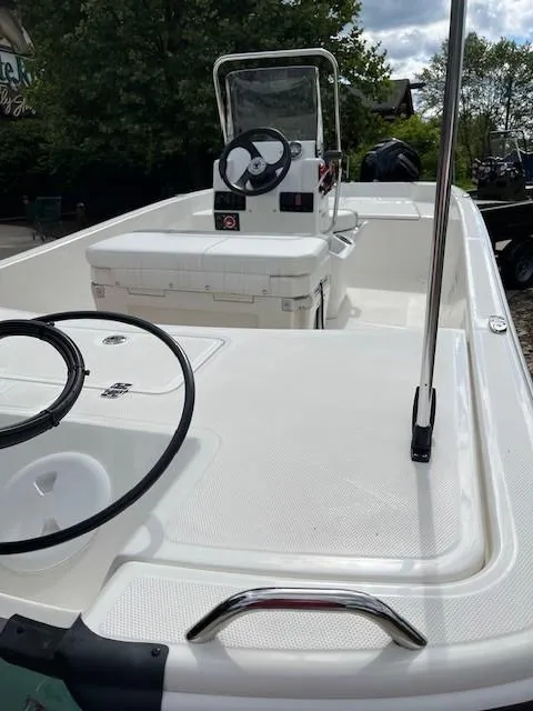 Slide: The Image of 2025 Mako Pro Skiff 17 CC boat interior with steering console and seating. - 45