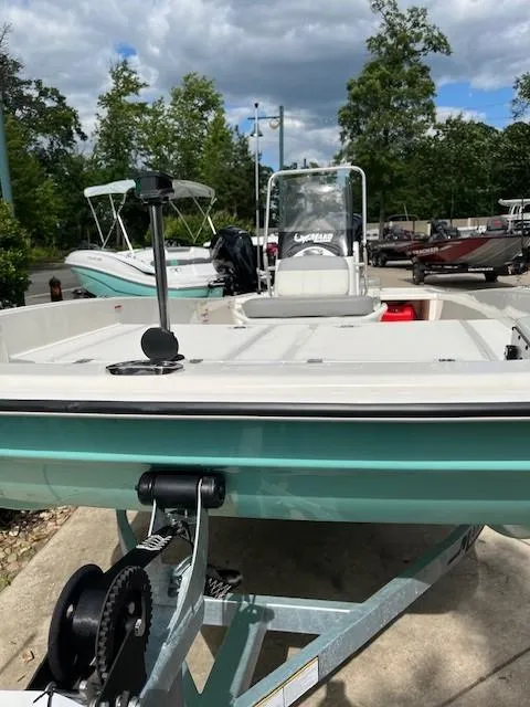 Slide: The Image of 2025 Mako Pro Skiff 17 CC boat on trailer, outdoors, under cloudy sky. - 46