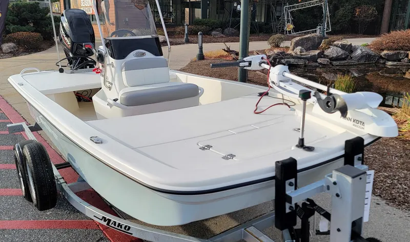 Slide: The Image of 2025 Mako Pro Skiff 13 CC boat on trailer, featuring sleek design and modern equipment. - 3