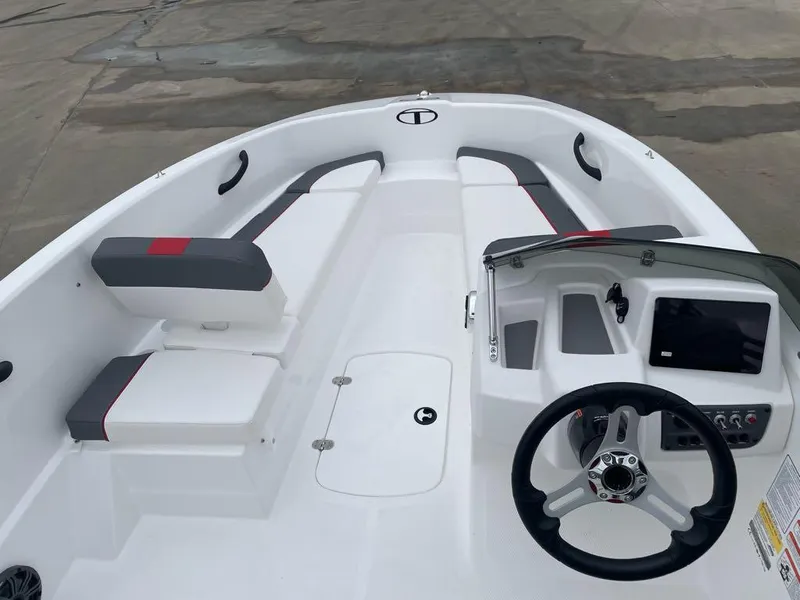 Slide: The Image of 2025 Tahoe T16 boat interior with steering wheel and seating. - 5