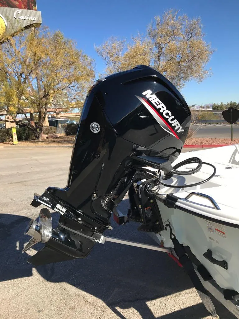 Slide: The Image of 2025 Mako Pro Skiff 17 CC with Mercury outboard motor in a sunny outdoor setting. - 3