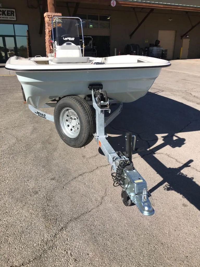Slide: The Image of 2025 Mako Pro Skiff 17 CC boat on trailer in outdoor setting. - 4