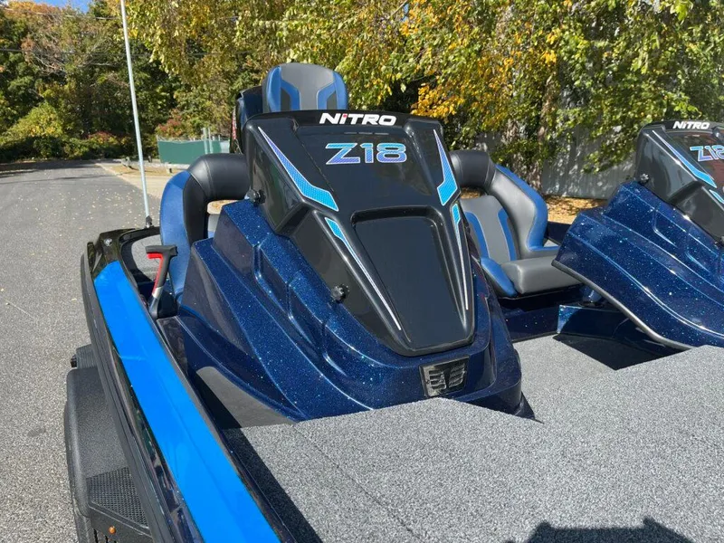 Slide: The Image of 2025 Nitro Z18 boat with sleek design and blue accents on a sunny day. - 13