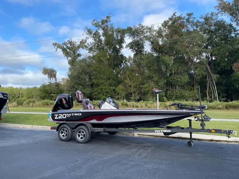 The Image of 2025 Nitro Z20 XL boat on trailer, parked outdoors. - 0