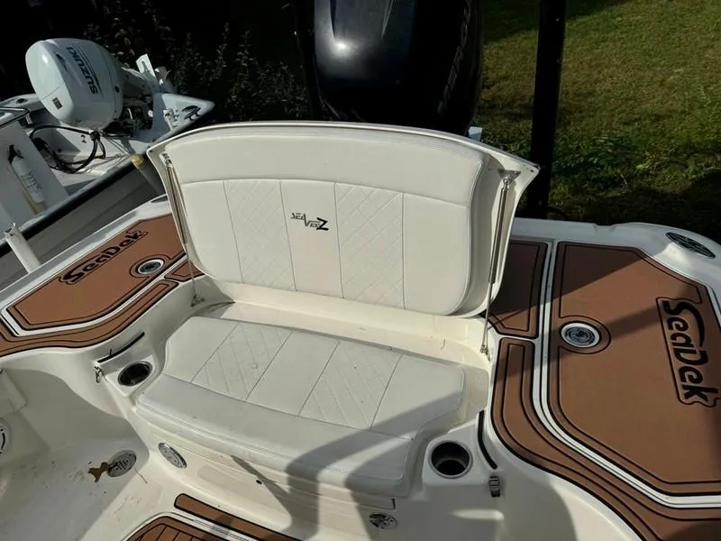 Slide: The Image of 2016 SeaVee 270Z boat with white seating and brown SeaDek flooring. - 21