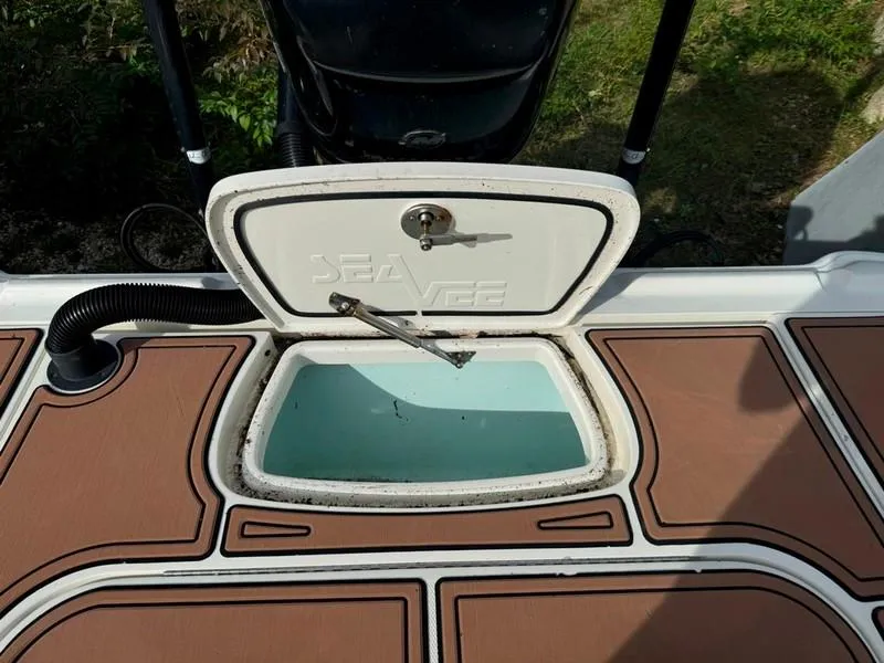 Slide: The Image of 2016 SeaVee 270Z boat livewell with open lid, showcasing interior. - 26