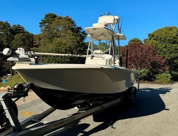 Slide: The Image of 2016 SeaVee 270Z boat on trailer, surrounded by trees. - 3