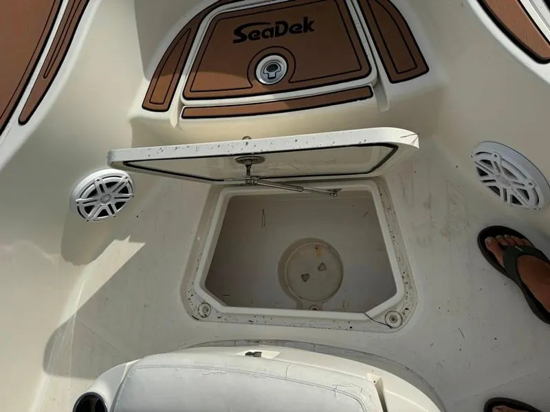 Slide: The Image of 2016 SeaVee 270Z boat deck with open storage compartment and SeaDek flooring. - 31
