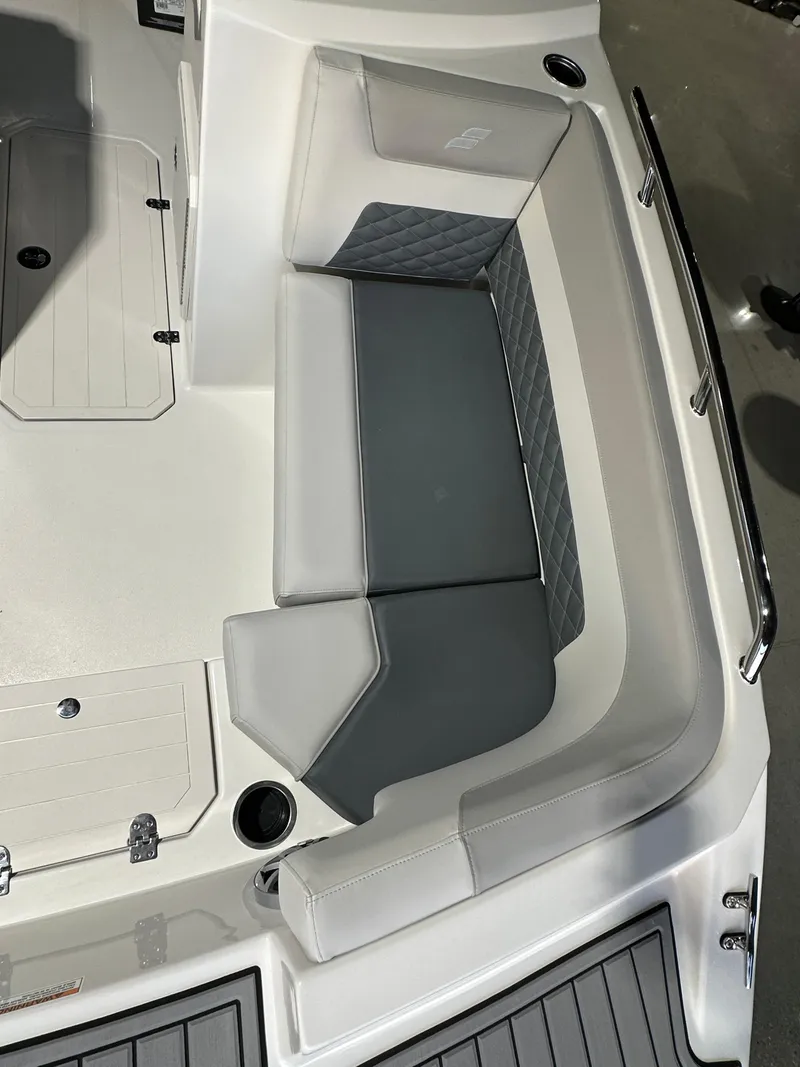 Slide: The Image of 2025 Starcraft SVX 211 IO boat interior with gray seating and modern design. - 5