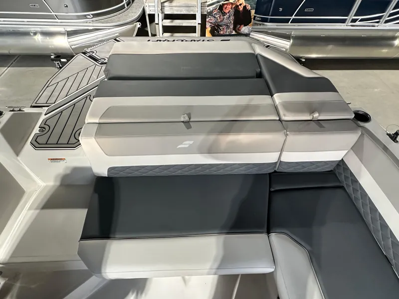 Slide: The Image of 2025 Starcraft SVX 211 IO boat interior seating, featuring sleek gray and white upholstery. - 7