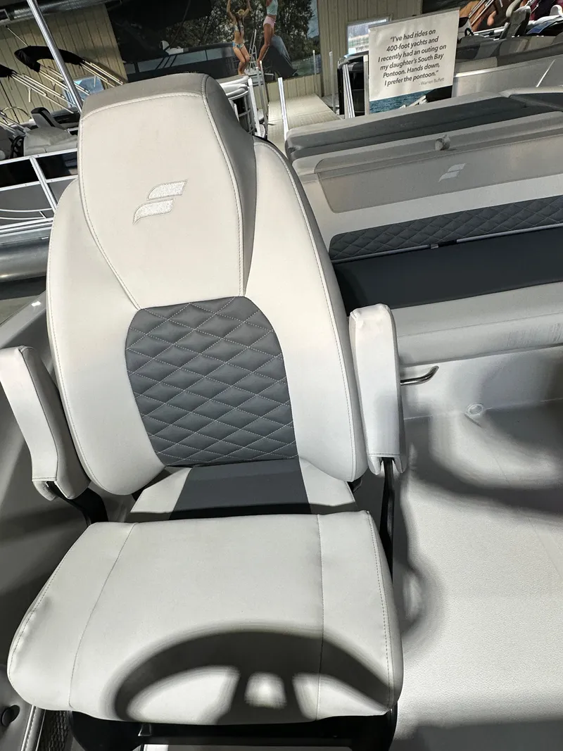 Slide: The Image of 2025 Starcraft SVX 211 IO boat seat with quilted design and armrests. - 8